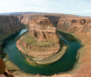 Scenic view of colorado river at horseshoe bend against sky