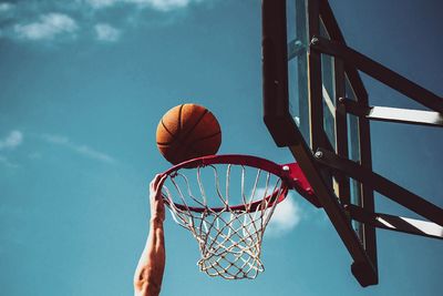 Low angle view of basketball hoop against sky