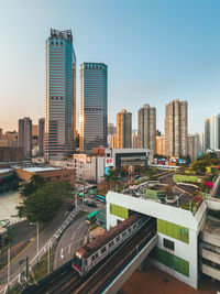 Modern buildings in city against sky