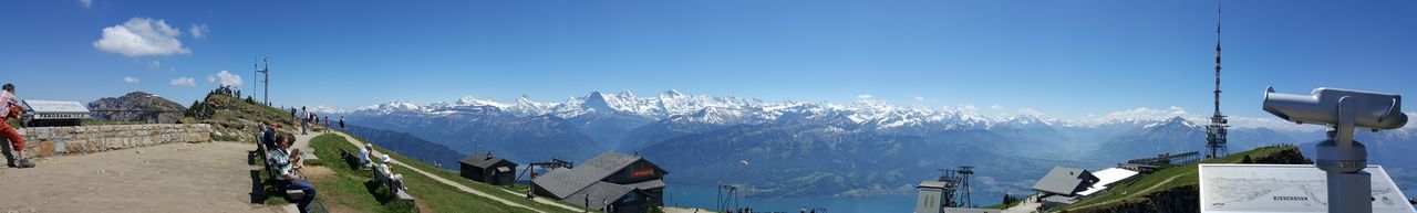 Panoramic view of mountains against clear blue sky