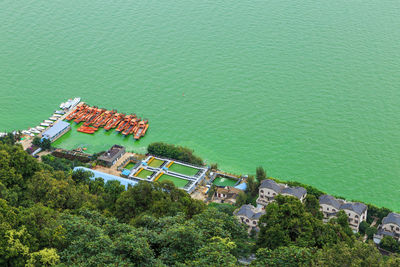 High angle view of buildings by sea