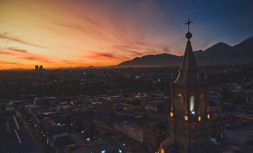 Aerial drone view of arequipa main square and cathedral church, with the misti volcano at sunset. 
