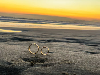Walking together,weeding rings during sunset at the seaside 