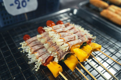 Close-up of meat on barbecue grill