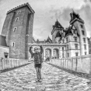 Woman standing in front of historic building