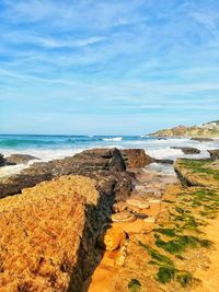 Scenic view of beach against sky