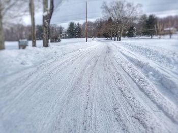 Close-up of tire tracks in winter