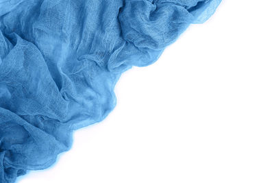 Close-up of blue paint on white background