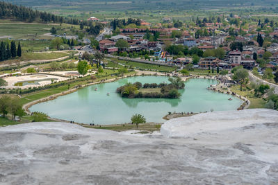 High angle view of river amidst buildings in city