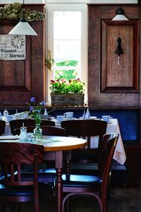 Empty chairs and table in restaurant