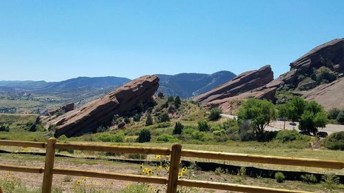 Scenic view of rocky mountains against clear blue sky