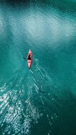 High angle view of red boat in sea
