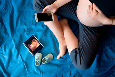 High angle view of woman using mobile phone