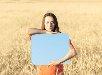 Young woman standing on field