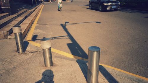 Low section of man on street in city