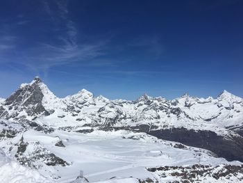 Idyllic shot of snowcapped mountains against sky