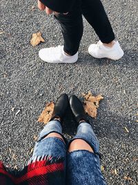 Low section of woman standing on ground