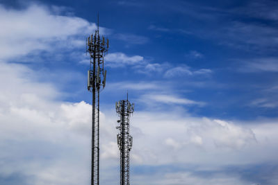 Low angle view of communications tower against sky