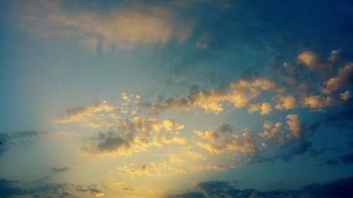 Low angle view of cloudy sky at sunset