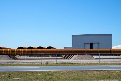 Low angle view of building against clear blue sky