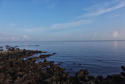 Scenic view of sea against blue sky