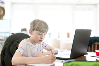 Tween working on homework remotely during shelter in place quarantine