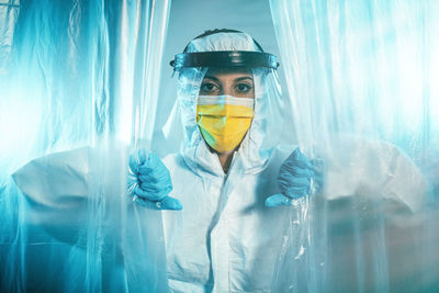 Nurse with mask enters the field hospital, intensive care. coronavirus checks.