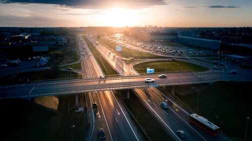 High angle view of light trails on highway at sunset