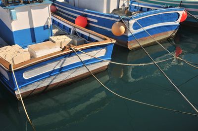 Boats moored at harbor