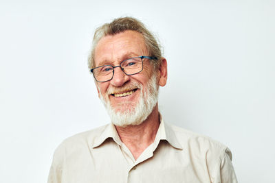 Portrait of young man against white background