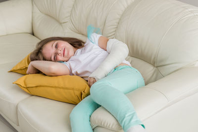 Young woman sleeping on bed at home