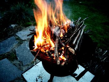 High angle view of fire burning in back yard