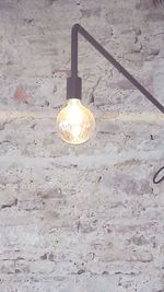 Close-up of illuminated light bulb