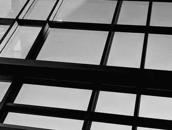 Low angle view of glass building against sky