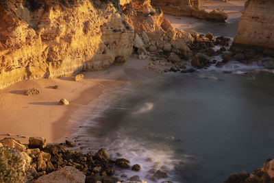 Algarve cliffs of mesquita beach at sunrise