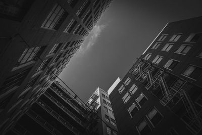 Low angle view of buildings against sky in city