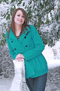 Portrait of smiling woman in snow