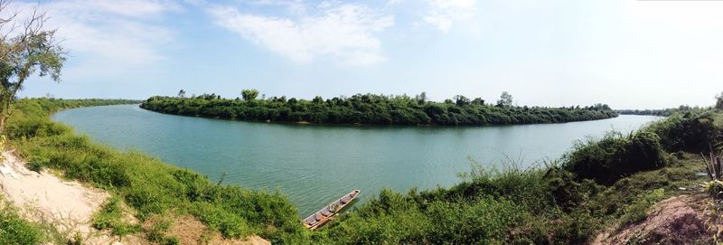 Scenic view of landscape against cloudy sky