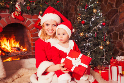 Portrait of happy girl with christmas tree