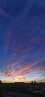 Scenic view of silhouette landscape against sky at sunset