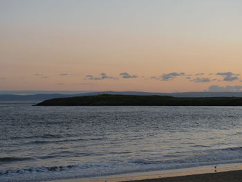 Scenic view of sea at sunset