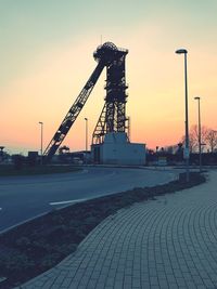 View of pier on street against sky during sunset