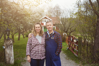 Portrait of mature couple standing on pathway