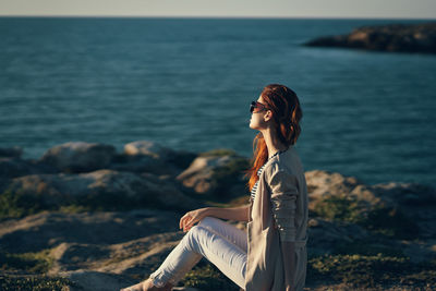 Woman looking at sea shore