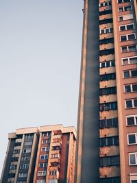 Low angle view of buildings against clear sky