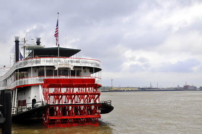 View of ship in sea against cloudy sky