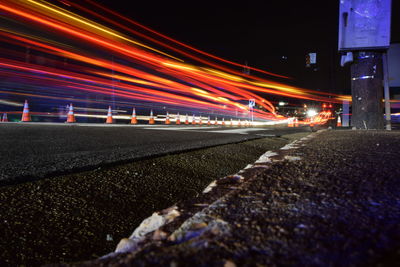 Surface level of illuminated city against sky at night