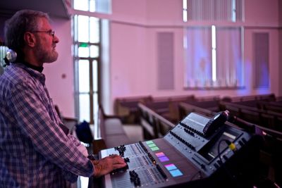 Close-up of man mixing sounds in studio