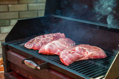 Close-up of meat on barbecue grill