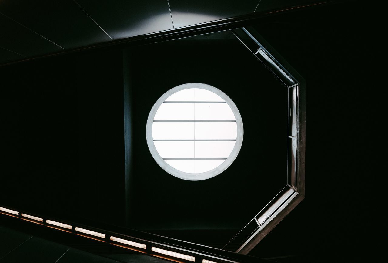 LOW ANGLE VIEW OF ILLUMINATED ELECTRIC LIGHT ON CEILING